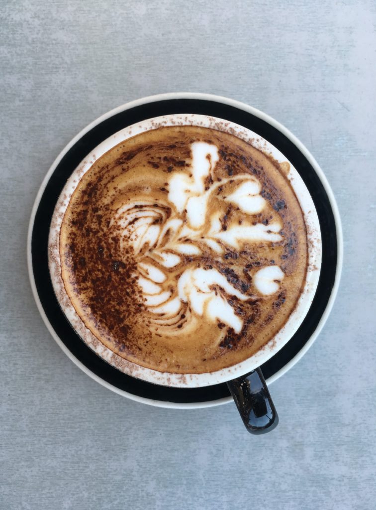 Coffee with beautiful latte art to help with lifehack of mindfulness meditation